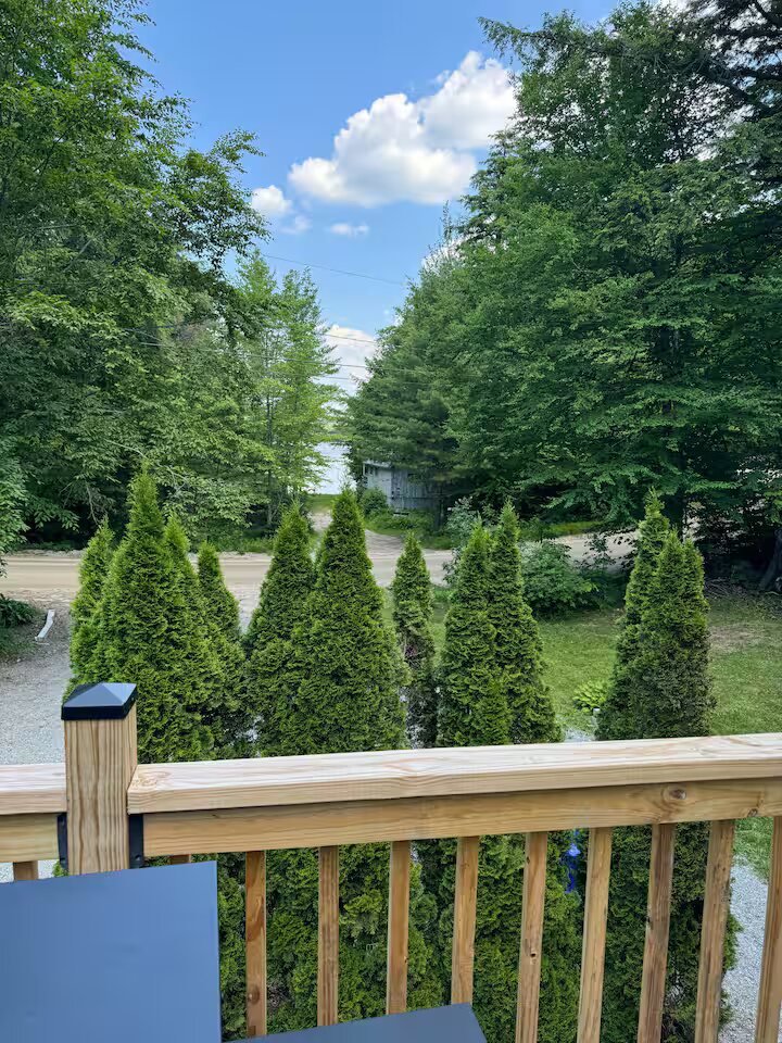 The view down toward Highland Lake from the front deck