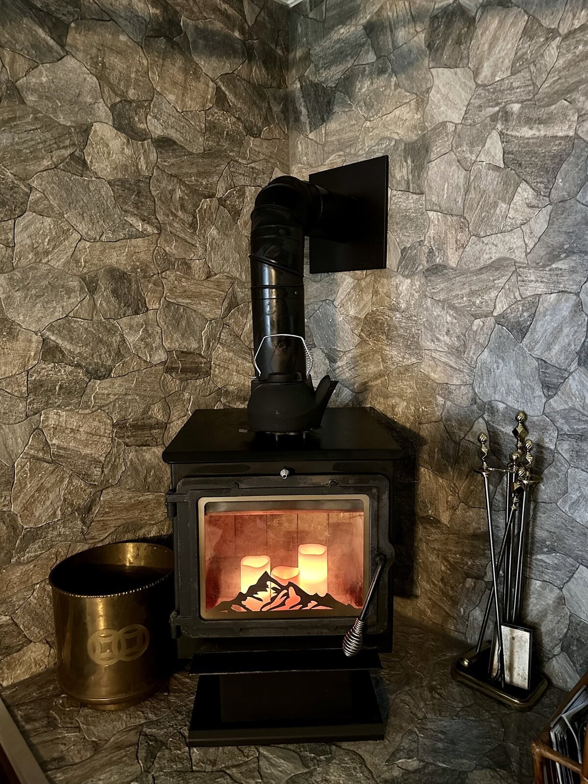 The wood stove burning in the living room